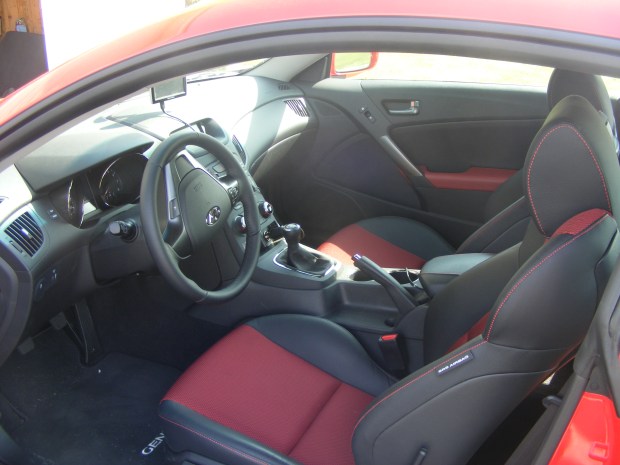Leather seats with contrasting red stitching and seat bottoms